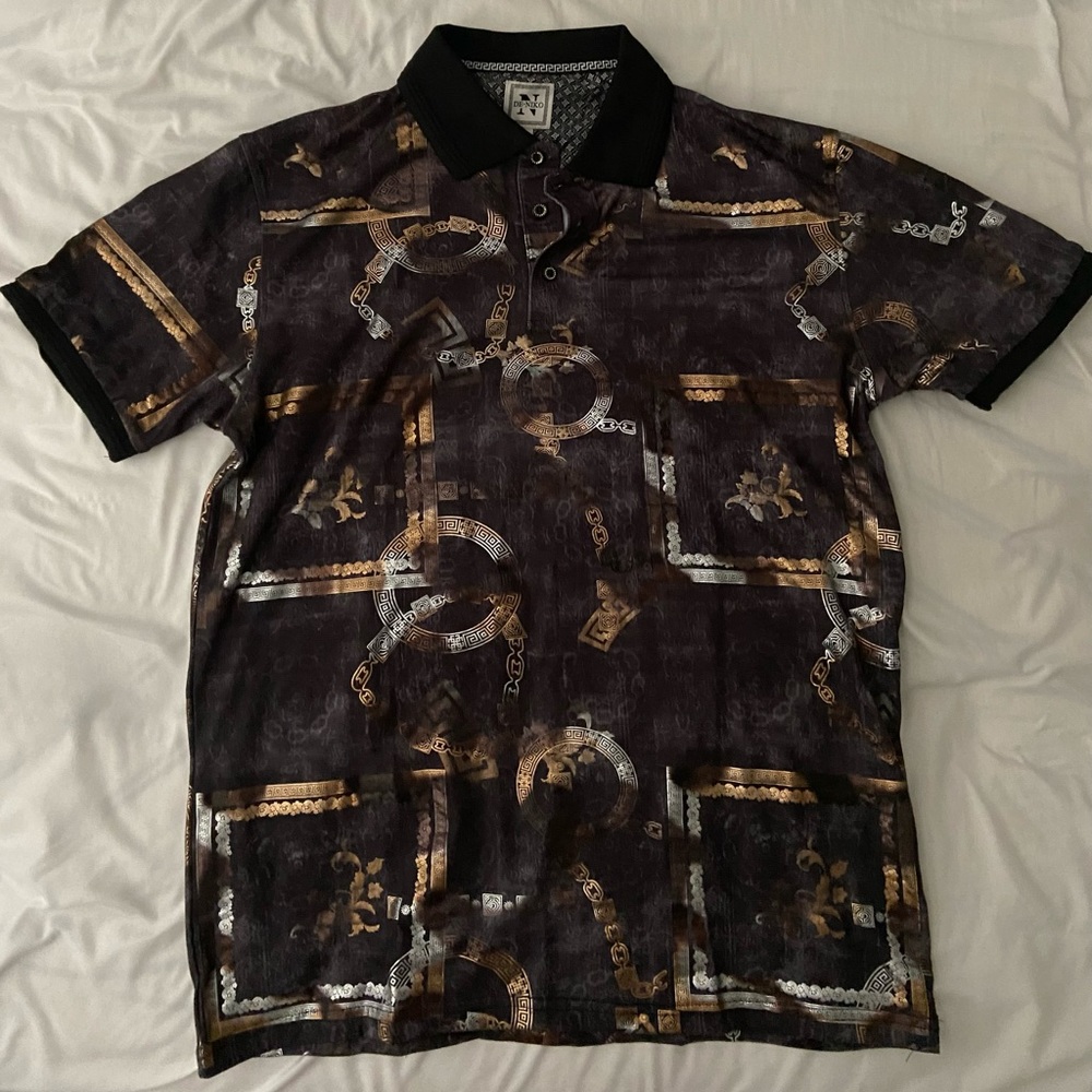 I am selling a black and gold de-niko polo, size large